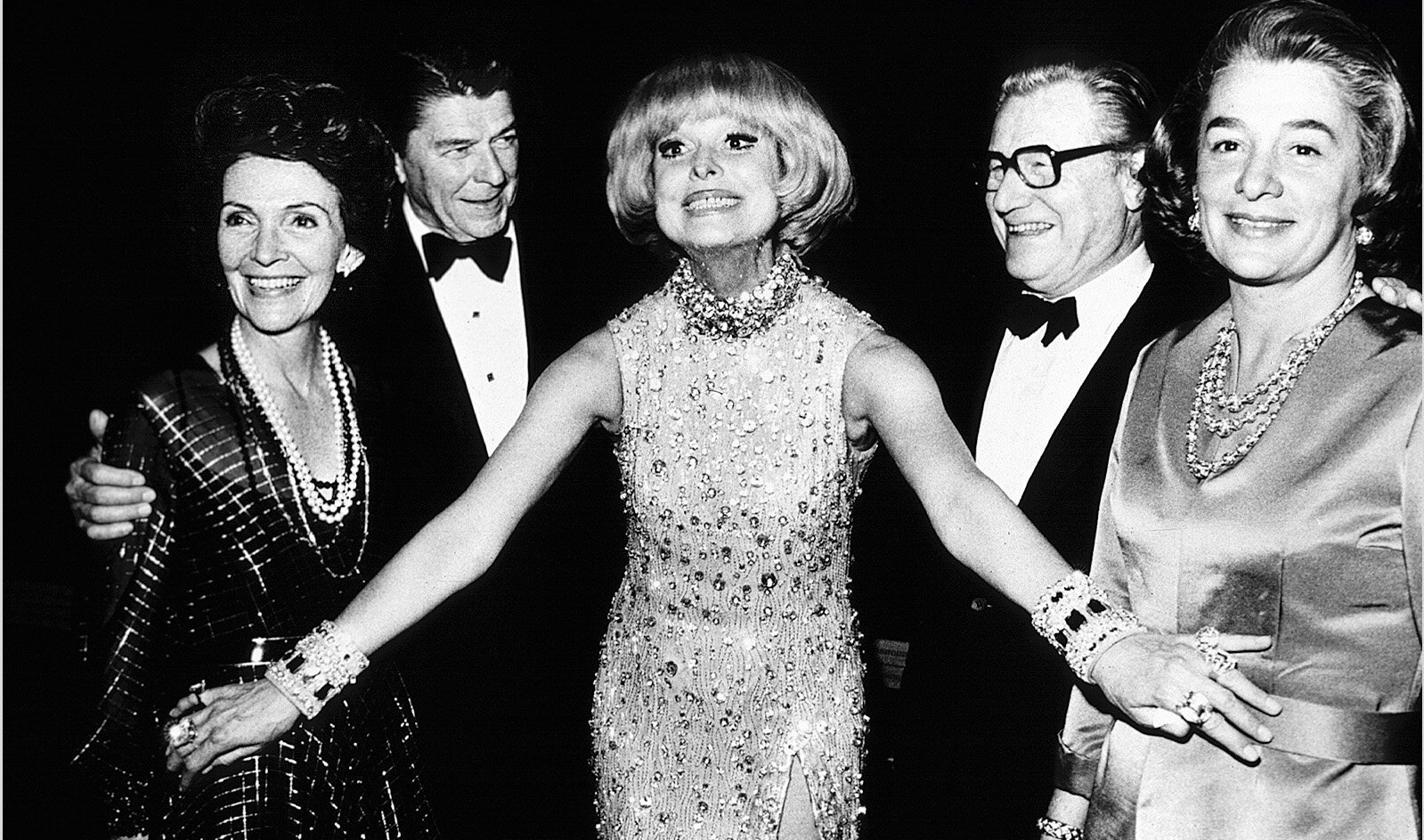  Carol Channing with 40th U.S. President Ronald Reagan and New York Governor Nelson Rockefeller backstage at the opening of “Hello Dolly.” © Christopher Little 
